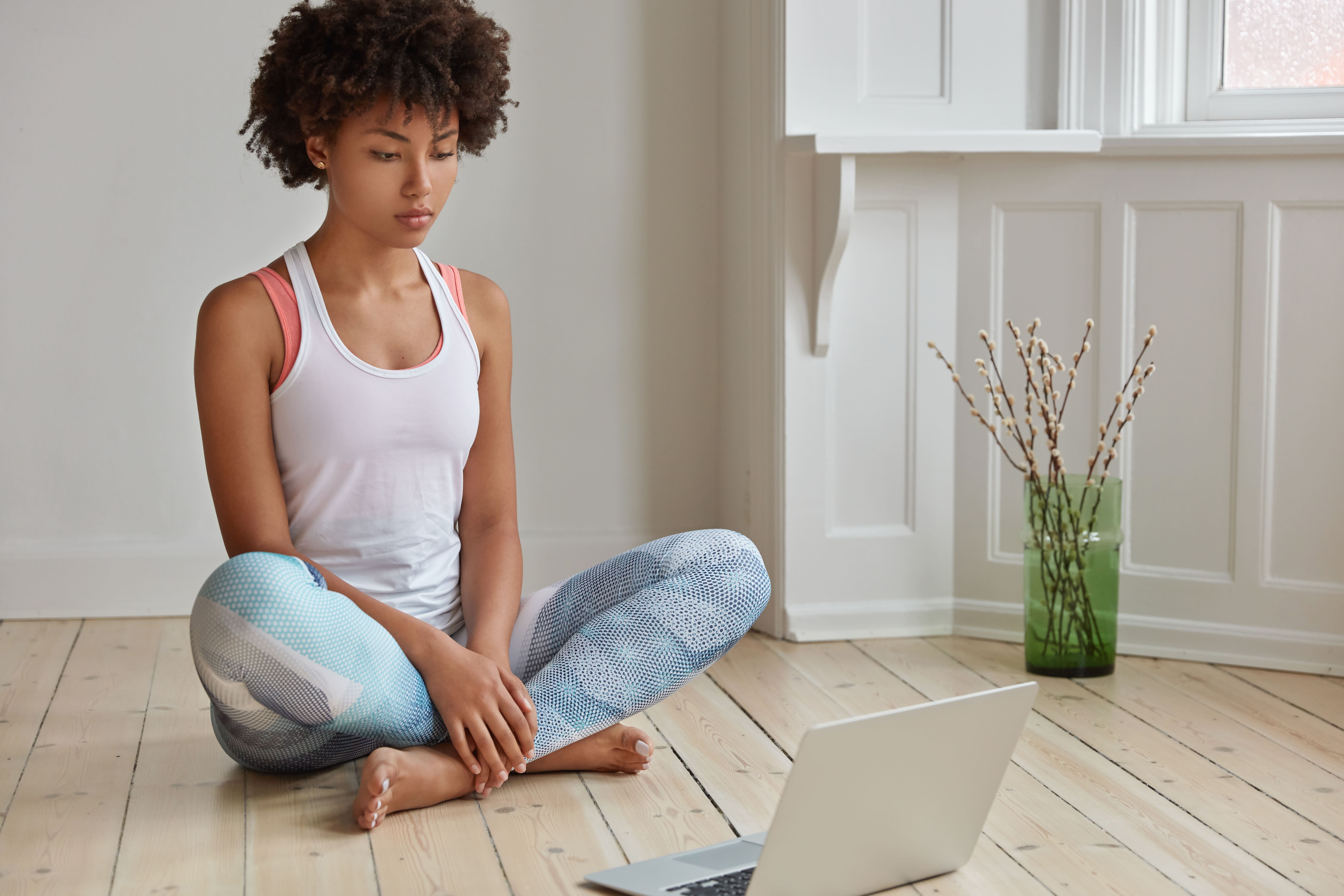 Person in a yoga pose at home
