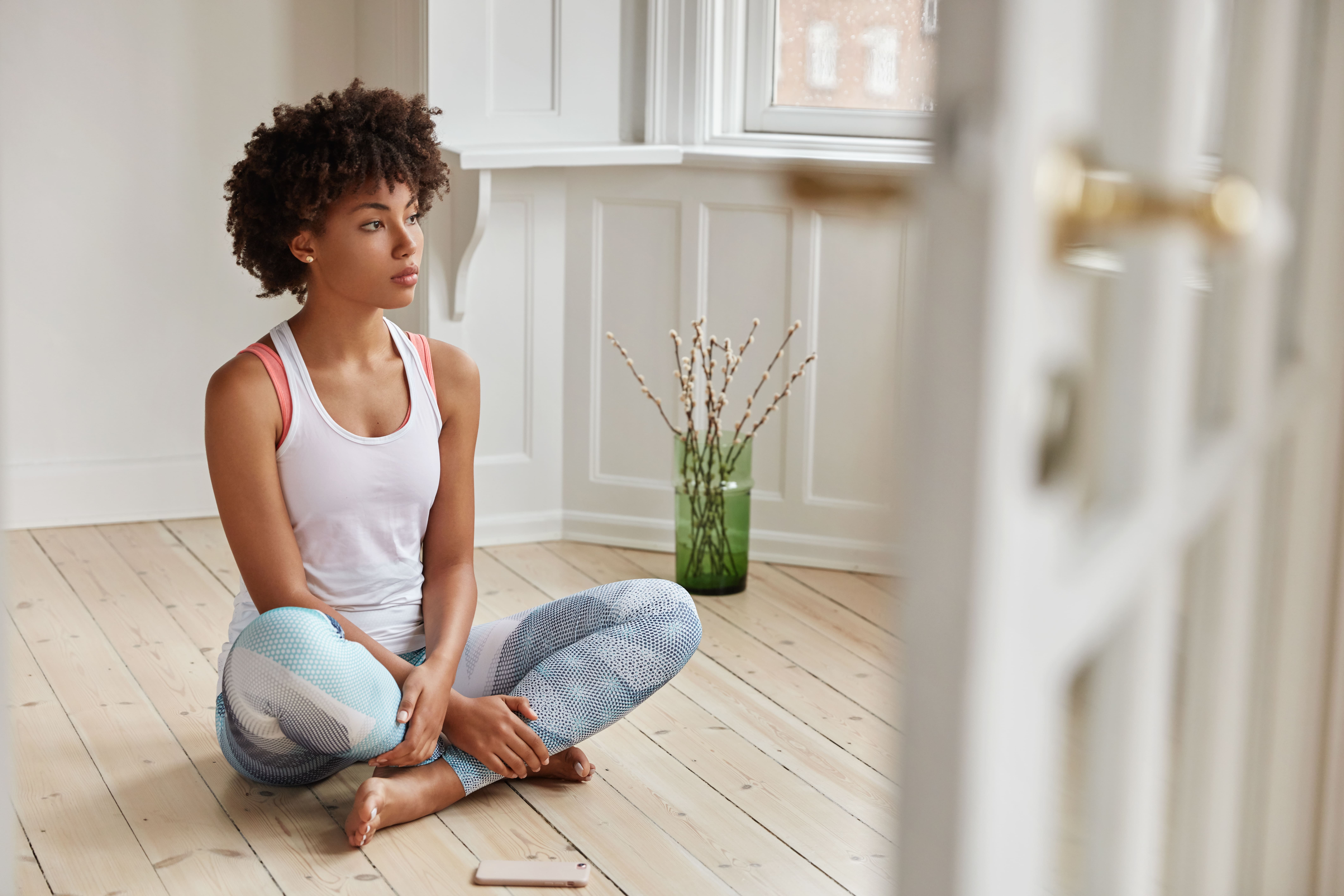 Person practicing yoga at home