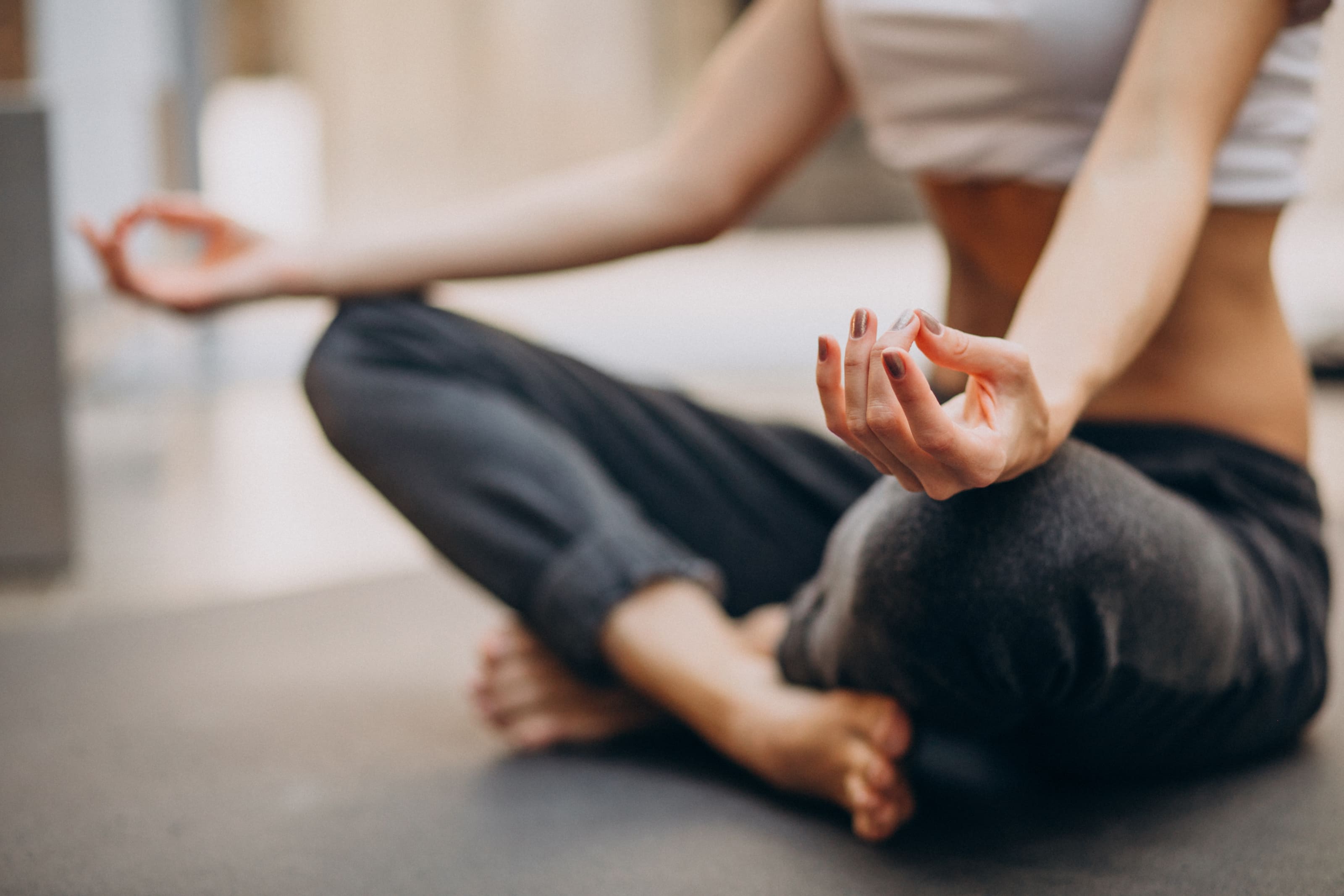 Person in a yoga pose indoors